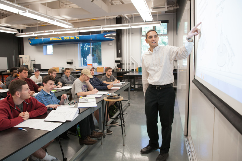 James Kaklamanos in front of classroom.
