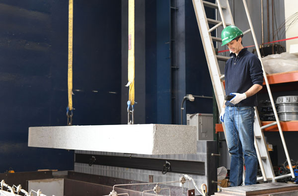 Greg McLaskey with experimental slab in his lab.