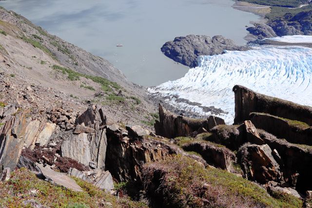 Portage Glacier, looking down on Portage Lake and a tour boat in the distance. 
