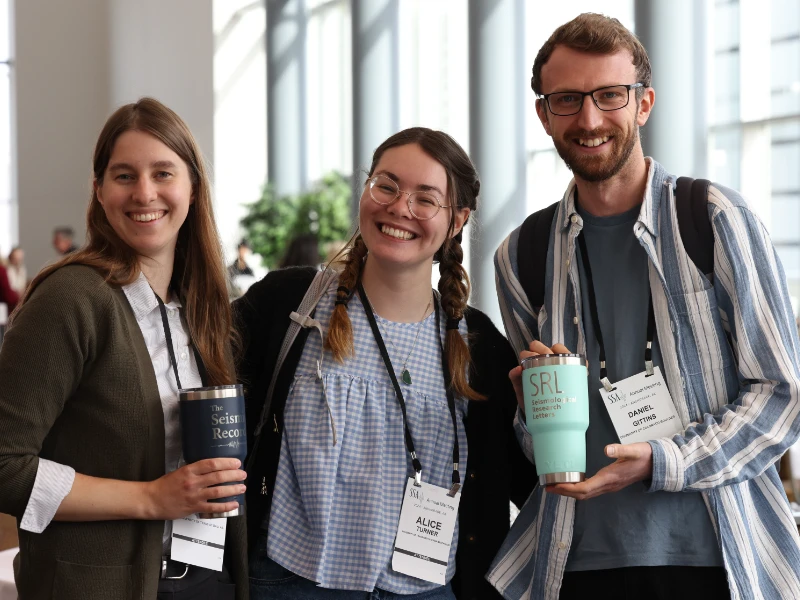 Three attendees at the Annual Meeting